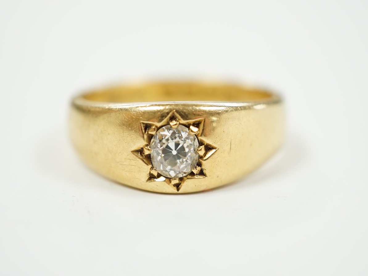 A late Victorian 18ct gold and gypsy set solitaire diamond ring, size Q, gross weight 7.5 grams.